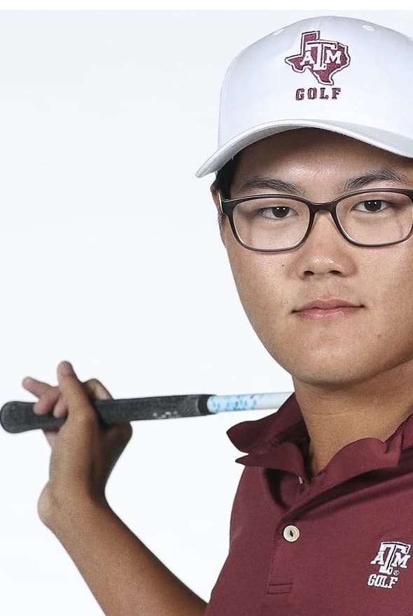 Portrait of Jimmy Lee with a club across his shoulders